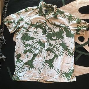 H&M L.O.G.G. green and white floral Hawaiian pattern shirt.